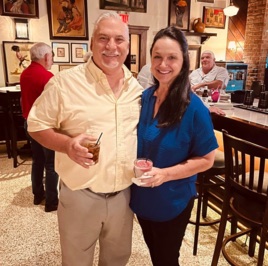 Two guests at an Acadiana community mixer