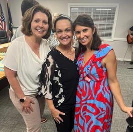 Friends of the firm at a community event
